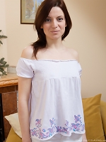 In nothing but her bright red heels Ginger Alice lays on the couch, her legs spread to show her hairy pussy in all of its hairy glory, dripping with a